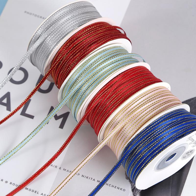 Trang Trí Noel Dải ruy băng vàng kim 3mm, lý tưởng cho gói quà, trang trí bánh, và DIY. Chất liệu satin cao cấp, dễ sử dụng cho mọi nhu cầu.